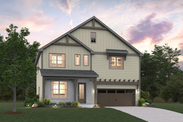 view of front of house featuring a garage, brick siding, a shingled roof, driveway, and a lawn