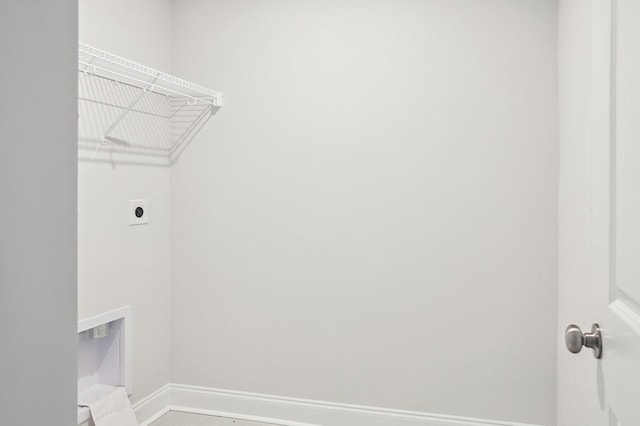 washroom featuring baseboards, laundry area, and hookup for an electric dryer