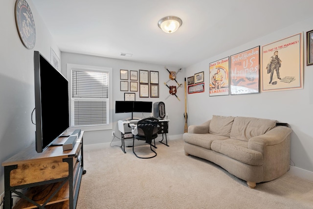 carpeted home office featuring visible vents and baseboards