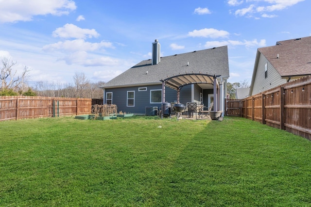 back of house with a patio, cooling unit, a fenced backyard, a shingled roof, and a lawn