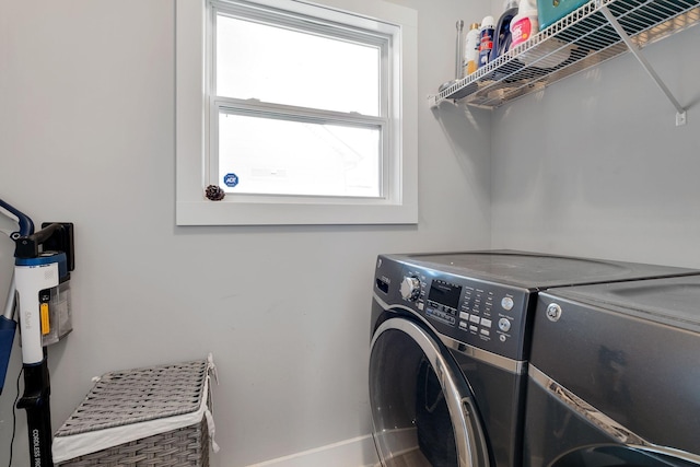 clothes washing area featuring laundry area and independent washer and dryer