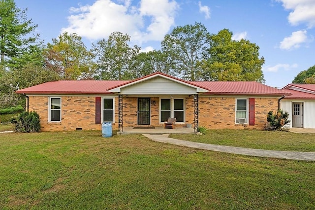 single story home featuring metal roof, brick siding, and a front yard