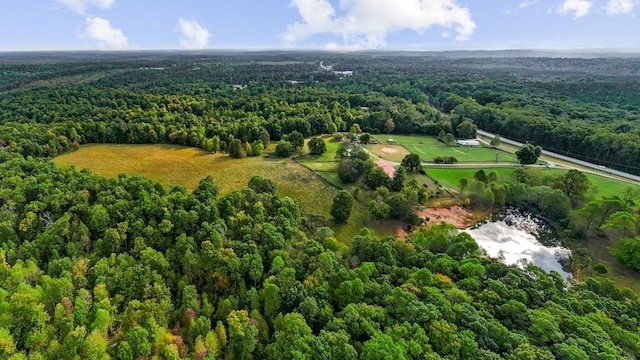 drone / aerial view featuring a view of trees