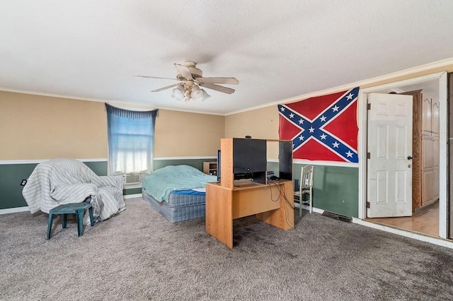 carpeted bedroom with baseboards, a ceiling fan, and crown molding