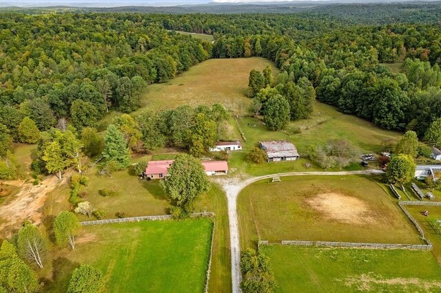 drone / aerial view with a rural view and a wooded view