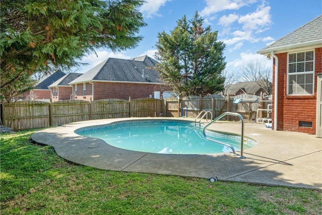 view of swimming pool featuring a patio area, a fenced backyard, a residential view, and a fenced in pool