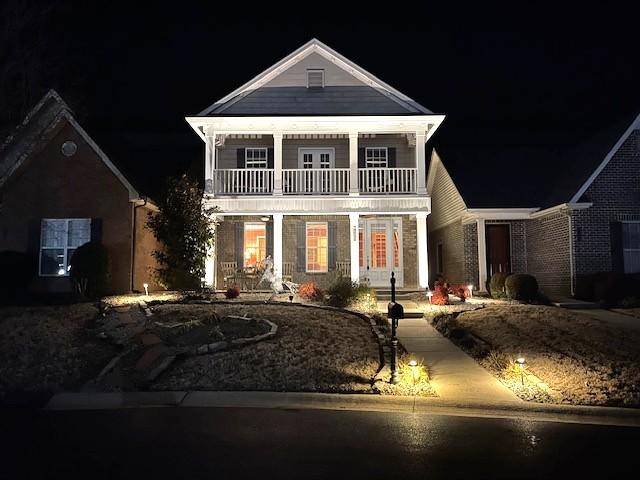 view of front of property with a balcony