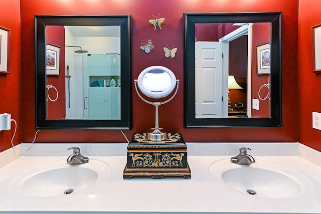 bathroom featuring walk in shower and vanity