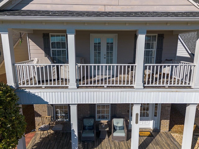 rear view of property featuring a balcony