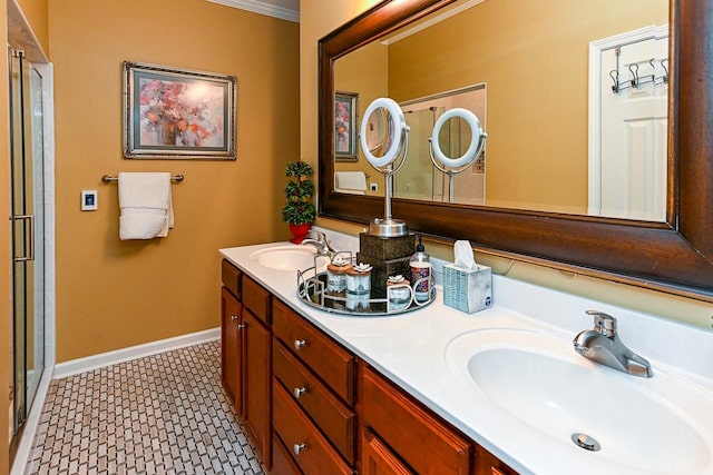 full bath with double vanity, an enclosed shower, a sink, and baseboards