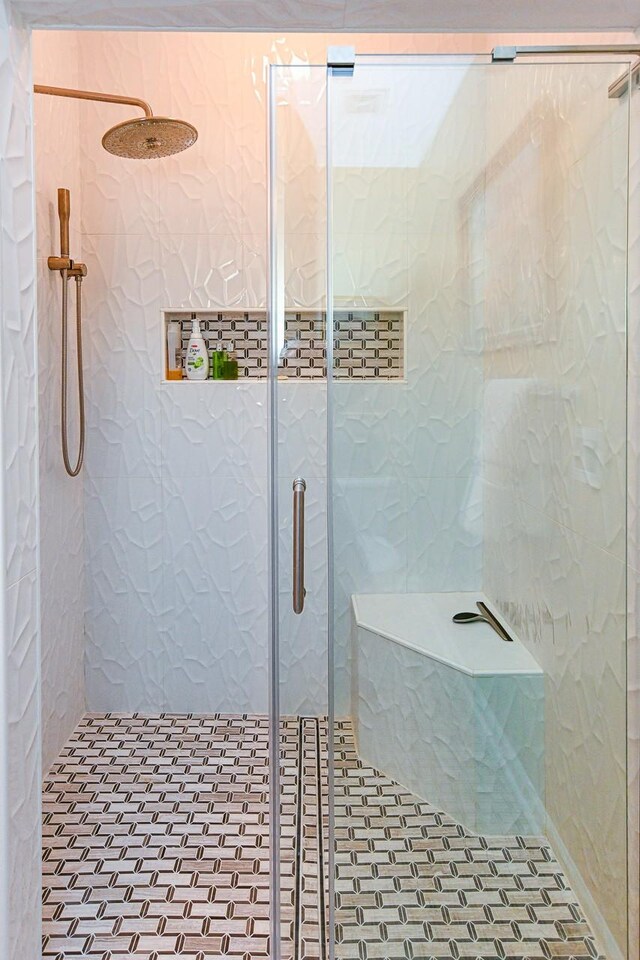 bathroom with a shower stall