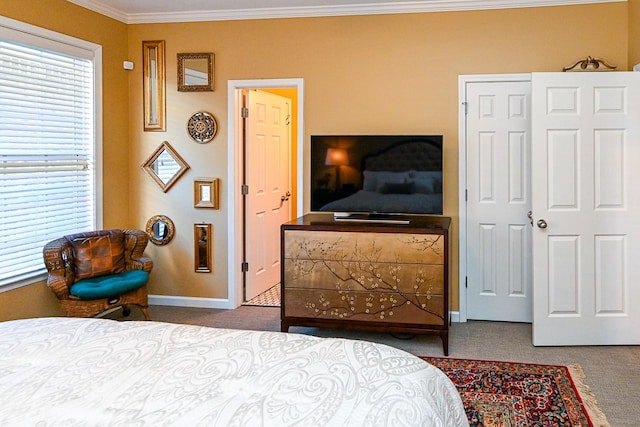 bedroom featuring ornamental molding, carpet, and baseboards