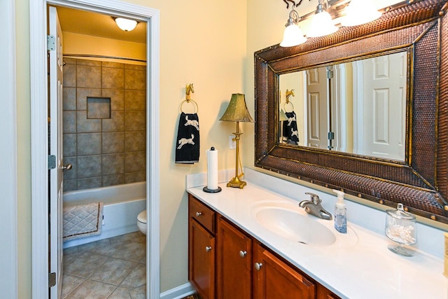 bathroom featuring tile patterned flooring, vanity, and toilet