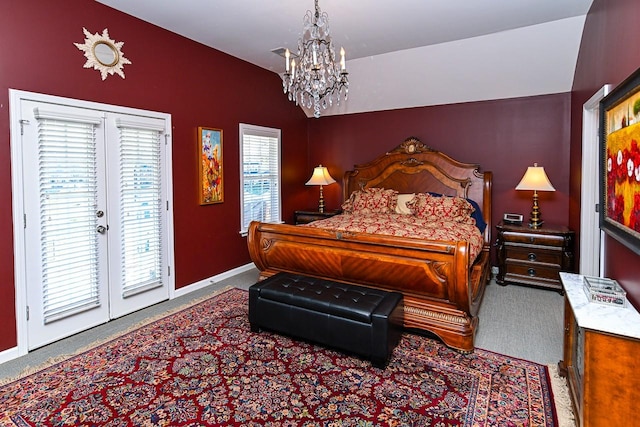 carpeted bedroom with a chandelier, access to outside, and baseboards