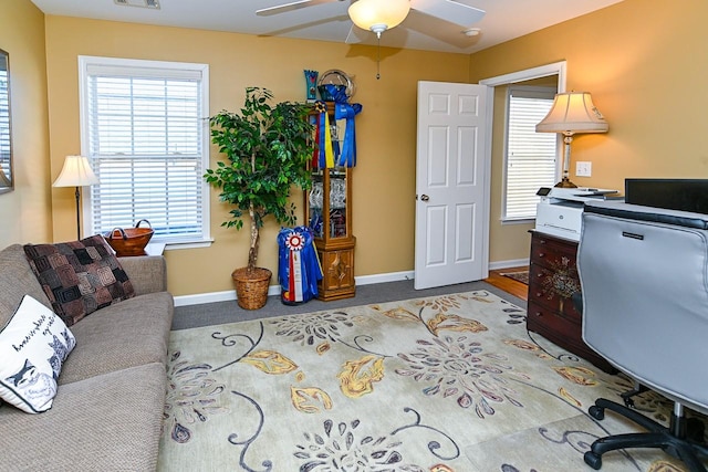 office area with visible vents, baseboards, and a ceiling fan