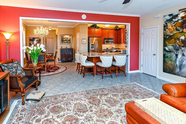 dining area with light tile patterned floors, crown molding, baseboards, and ceiling fan with notable chandelier