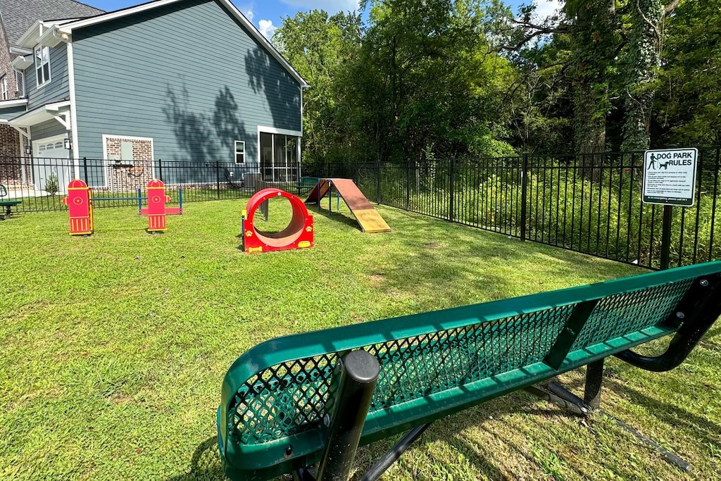 exterior space featuring a yard and fence