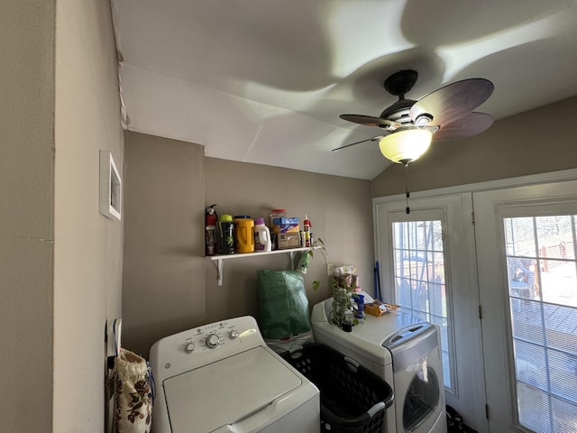 clothes washing area with visible vents, a ceiling fan, laundry area, and washing machine and clothes dryer