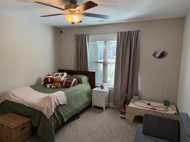 bedroom with carpet and ceiling fan