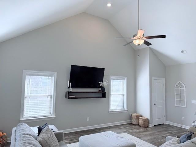 living room featuring high vaulted ceiling, baseboards, wood finished floors, and recessed lighting