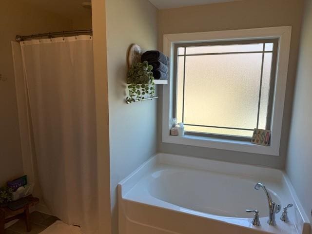 full bathroom featuring curtained shower and a bath