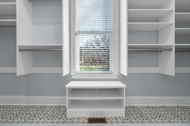 spacious closet with tile patterned flooring