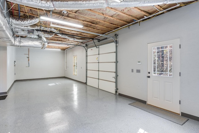 garage featuring baseboards