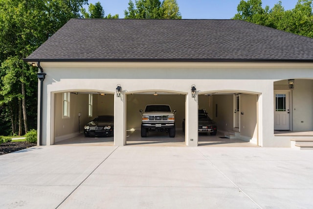 garage with concrete driveway