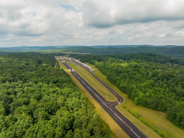 birds eye view of property with a forest view