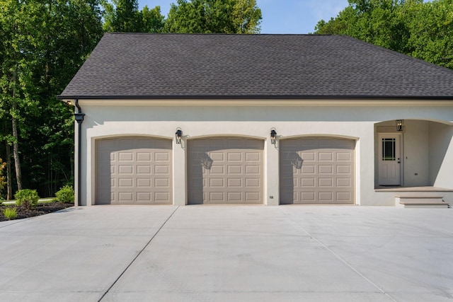 garage featuring driveway