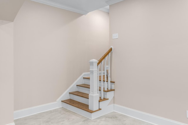 stairway with baseboards and ornamental molding