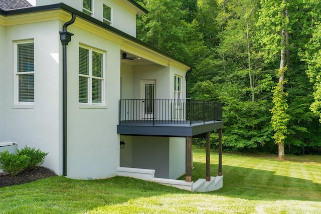 view of property exterior featuring a yard and stucco siding