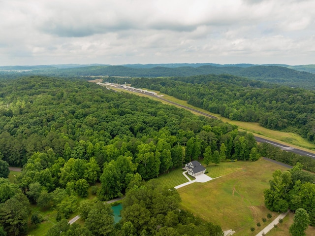 drone / aerial view with a view of trees