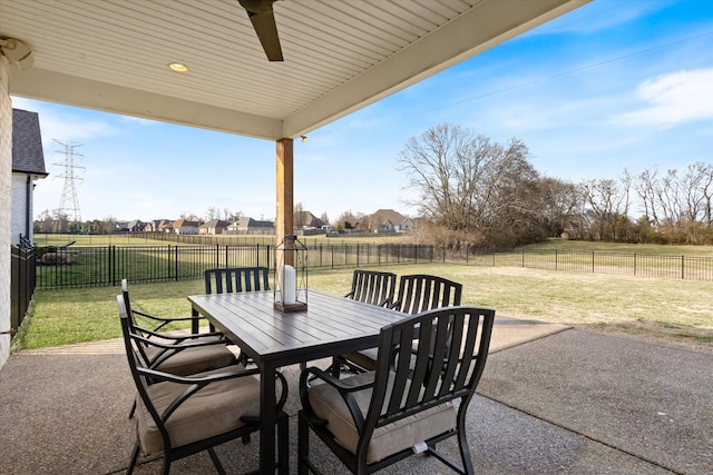 view of patio featuring outdoor dining area and a fenced backyard