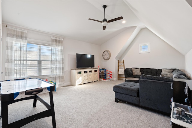 living room featuring a ceiling fan, carpet, and lofted ceiling