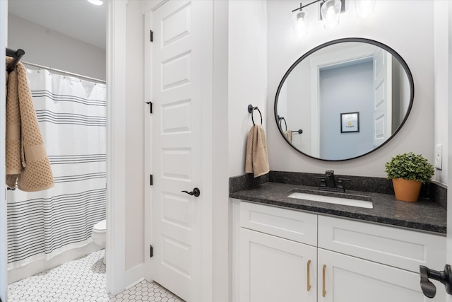 full bath featuring toilet, tile patterned flooring, a shower with shower curtain, and vanity