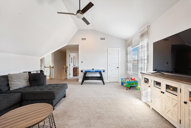 living room with a ceiling fan, lofted ceiling, visible vents, and light carpet