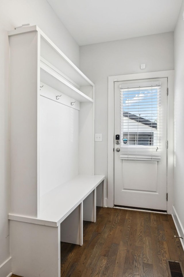 mudroom featuring dark wood-style flooring and visible vents