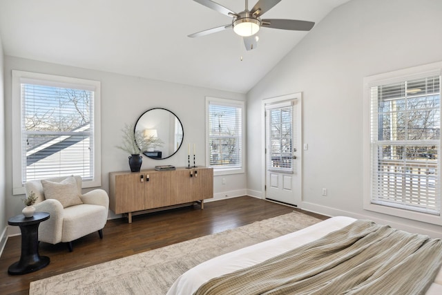 bedroom with vaulted ceiling, baseboards, dark wood finished floors, and a ceiling fan