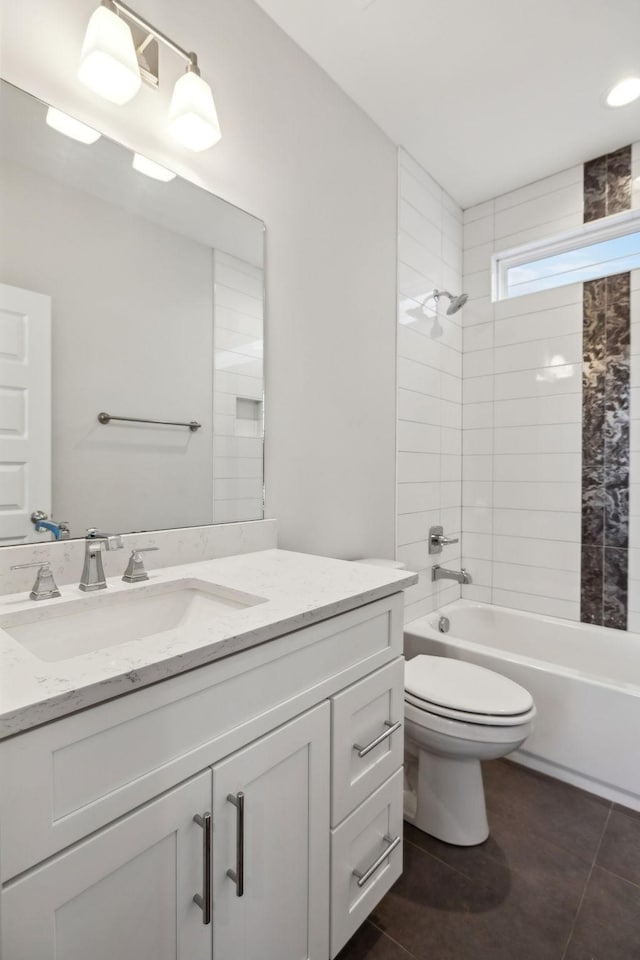 bathroom with toilet, tile patterned flooring, tub / shower combination, and vanity