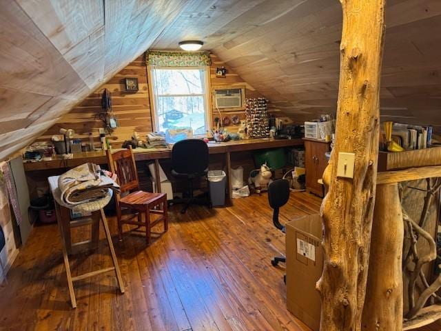 office with wooden ceiling, wood finished floors, vaulted ceiling, an AC wall unit, and wood walls