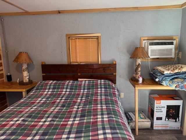 bedroom featuring a wall mounted AC