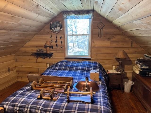 bedroom with wooden ceiling, wood finished floors, and wooden walls