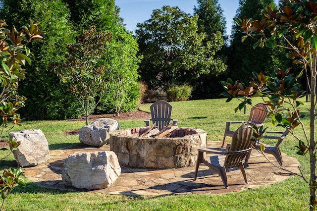 view of yard with an outdoor fire pit and a patio area