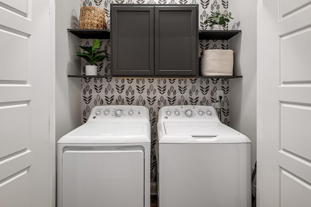 laundry area with cabinet space and washing machine and dryer