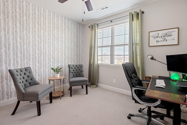 office with light carpet, a ceiling fan, visible vents, and baseboards