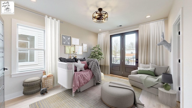 sitting room with french doors, recessed lighting, visible vents, light wood-type flooring, and baseboards