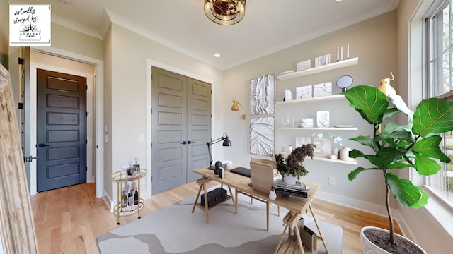 office space featuring light wood-type flooring, crown molding, baseboards, and recessed lighting