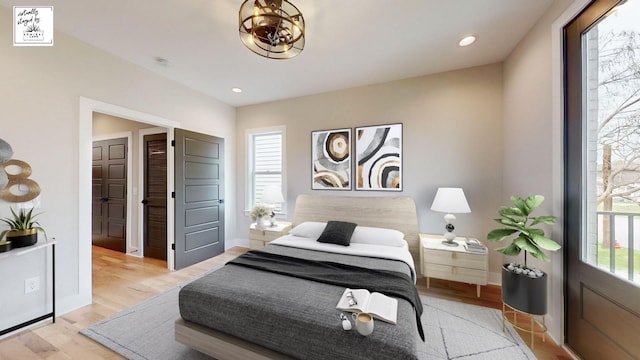 bedroom featuring light wood-style floors, baseboards, and recessed lighting