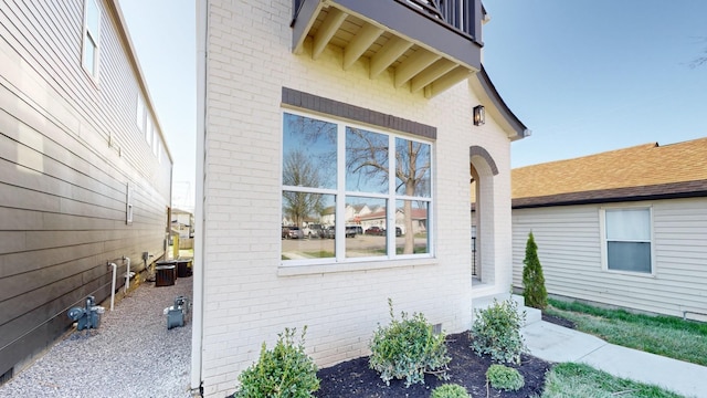 view of side of property with brick siding